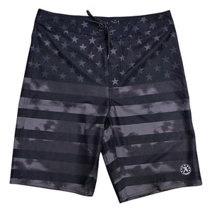 Front of Allegiance Stealth Banner Boardshort featuring tonal black American flag design, lace-up waistband, and reflective logo detail.